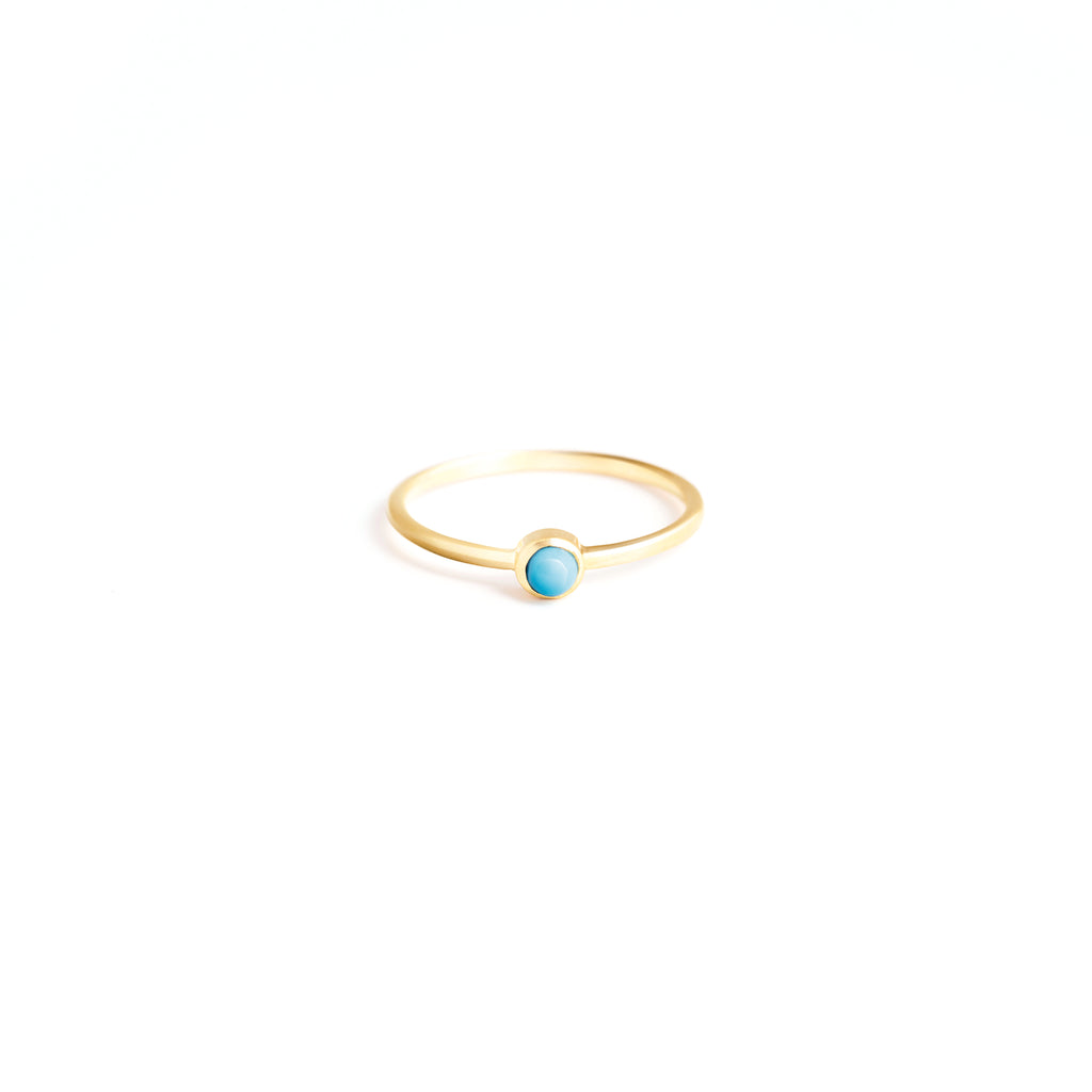 Wanderlust Life Birthstone Jewellery Collection. New December birthstone gold ring with turquoise semi precious gemstone, the perfect gift of jewellery. Wanderlust Life handmade jewellery in the UK.