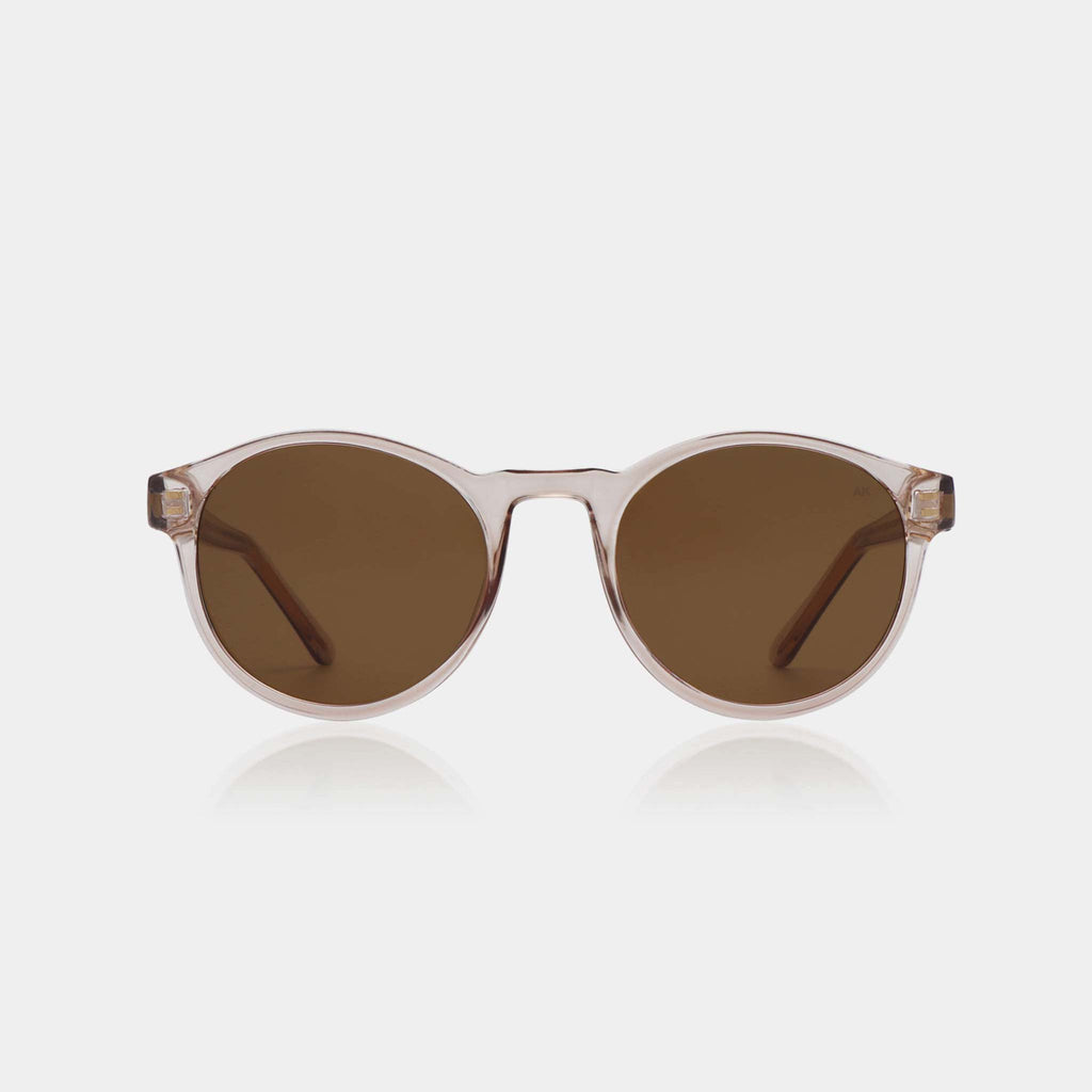Marvin is a classic yet minimal shape and an effortless everyday choice. These UV protective sunglasses feature brown lenses and champagne pink frames.