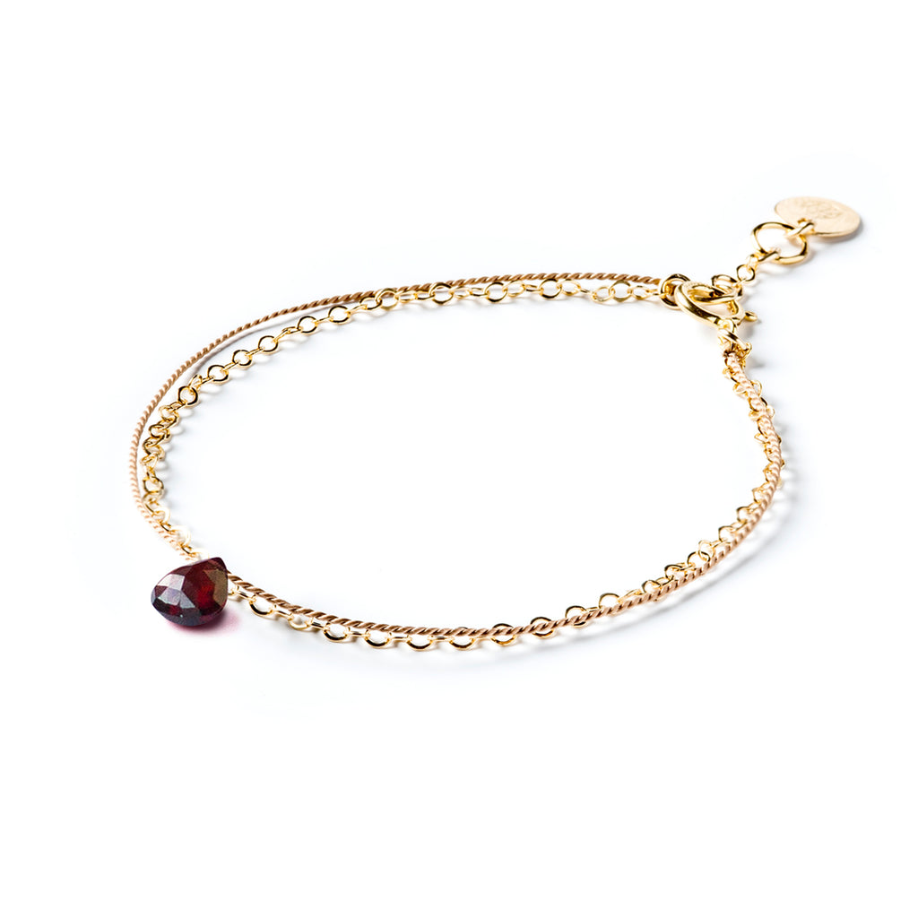 Wanderlust Life Ethically Handmade jewellery made in the UK. Minimalist gold and fine cord jewellery. january birthstone, gold & silk garnet bracelet