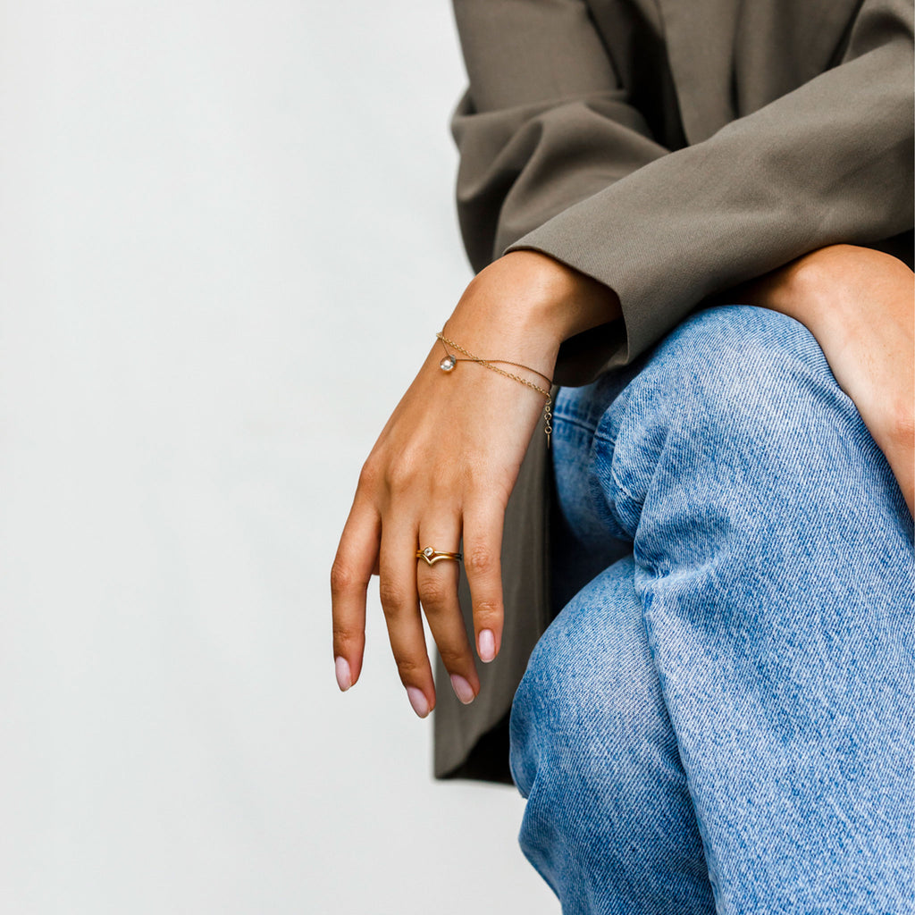Wishbone Gold Ring. A 14 carat gold plated silver ring with smooth curves ending in a striking point. Proudly designed in Devon & handcrafted by our Wanderlust Life global artisan partners.
