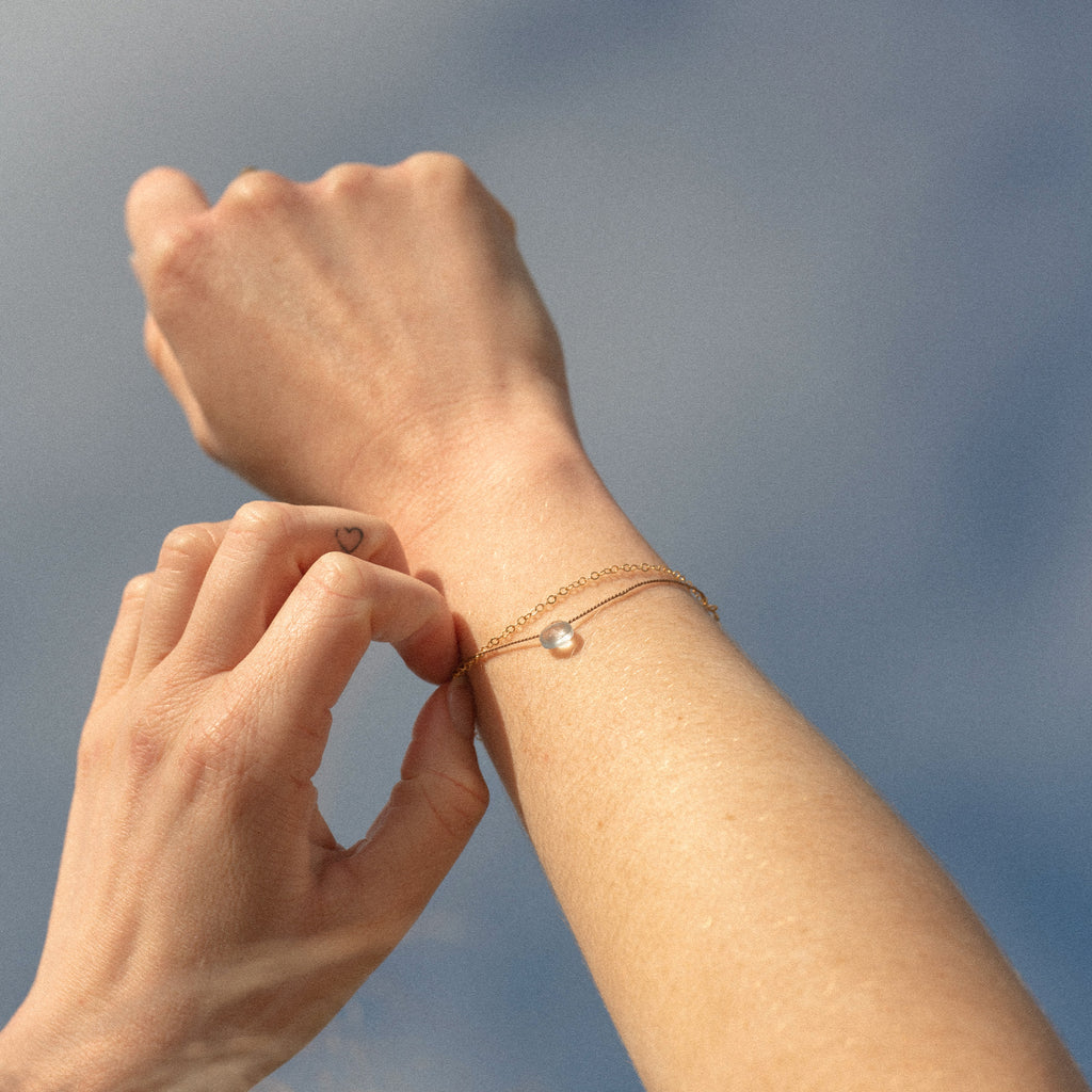 Wanderlust Life Ethically Handmade jewellery made in the UK. Minimalist gold and fine cord jewellery. march birthstone, gold & silk aquamarine bracelet